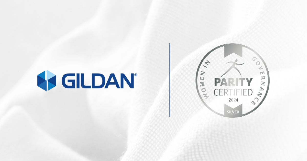 Gildan logo and Women in Governance Silver Level Parity Certified Logo against a white fabric backdrop