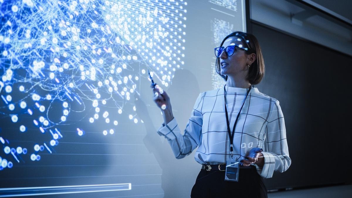 Woman presenting at large screen