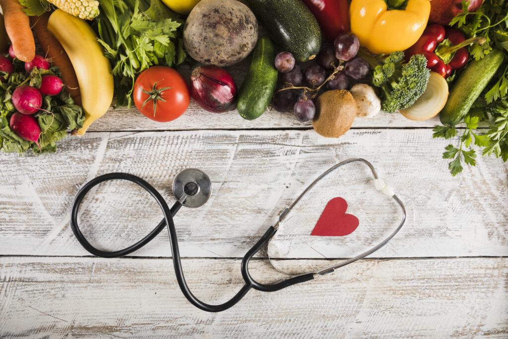 Fruit and vegetables shown with a stethoscope.