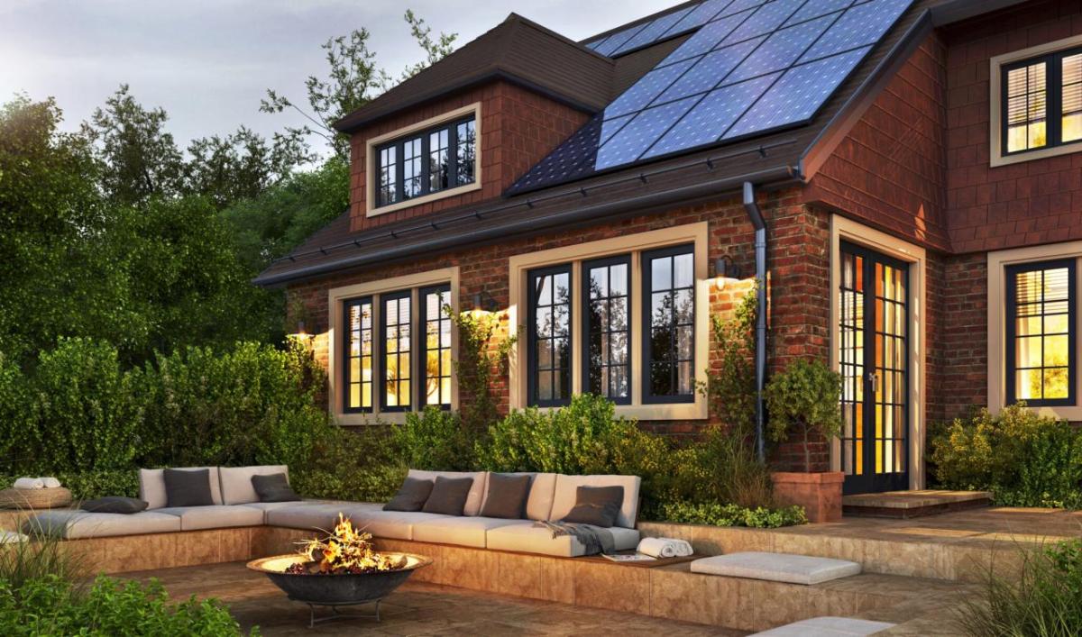 Exterior of a house with a fire pit in the backyard 