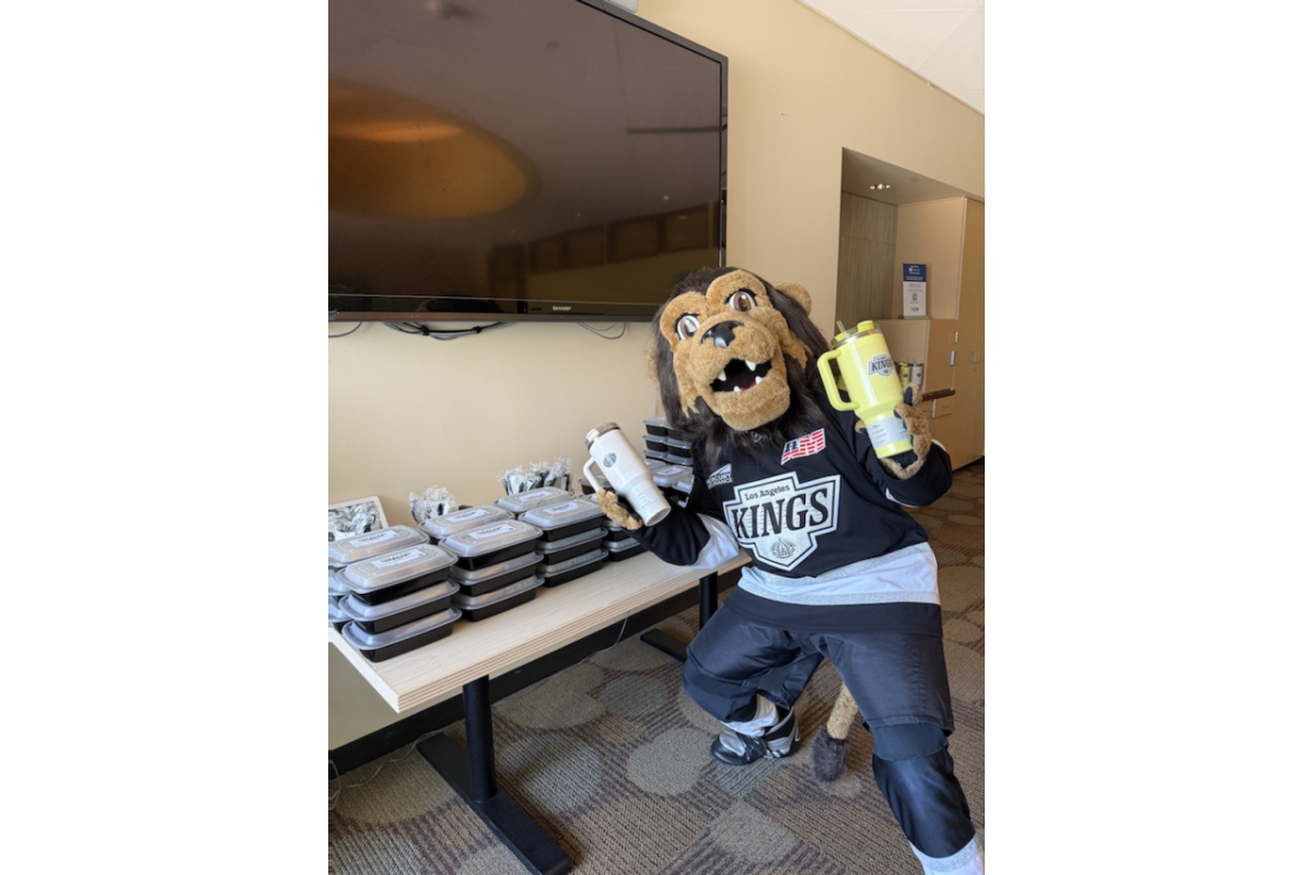 Los Angeles Kings Mascot Bailey posing in front of SuperFd meals