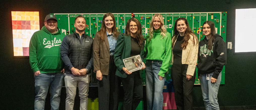 Members of the Eagles Autism Foundation, the Tork Coalition for Inclusive Hygiene, and the Philadelphia Eagles organizations meet at Lincoln Financial Field to plan the restroom upgrade execution. 