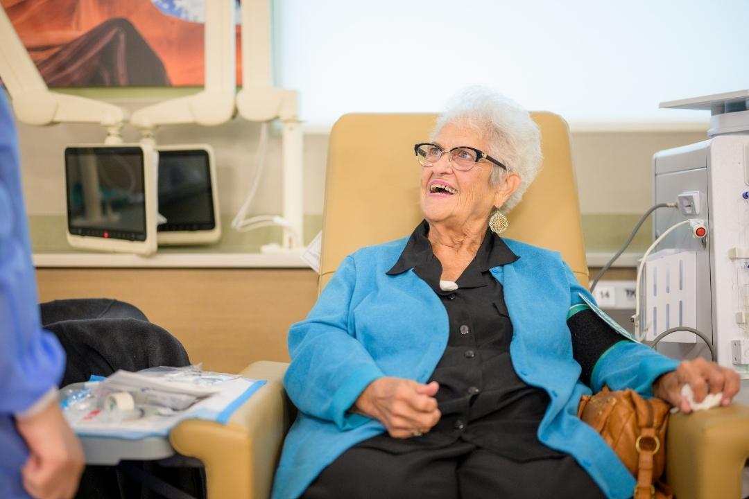 Elderly patient speaking to healthcare provider