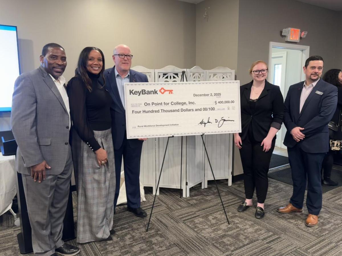 People holding an oversized check