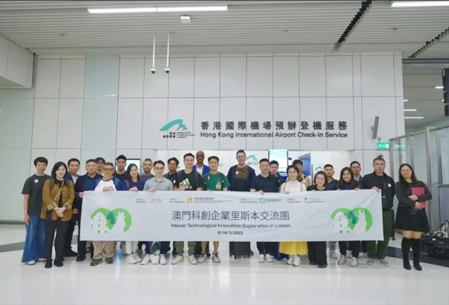 Group holding up large banner