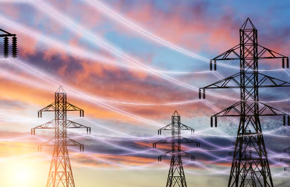 electric power transfer towers at sunset