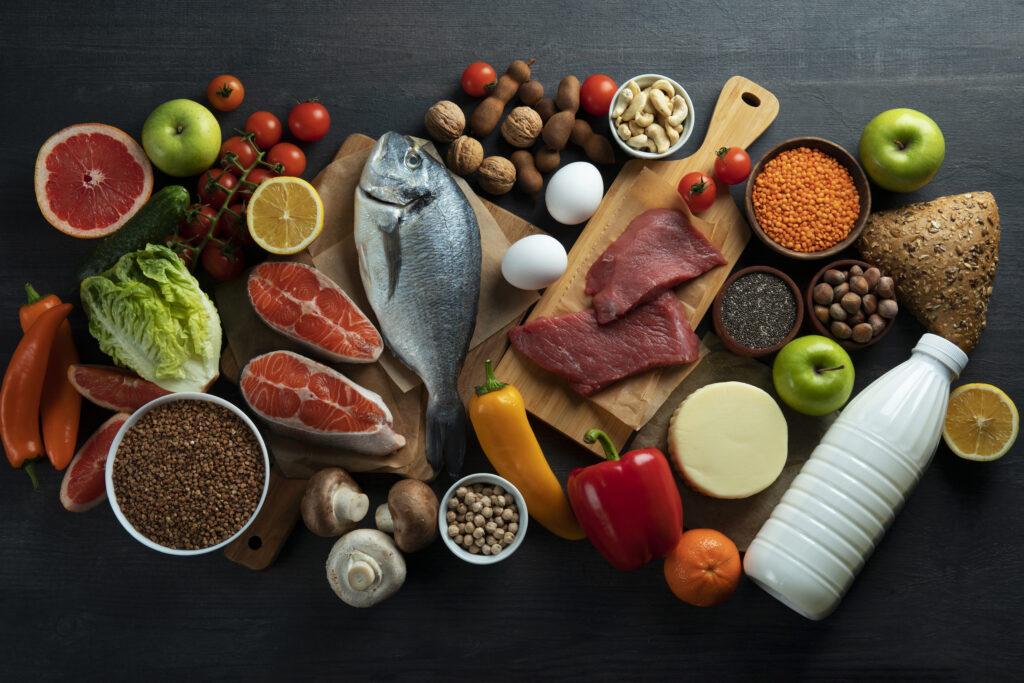 Array of different meat, fish, fruits and vegetables.