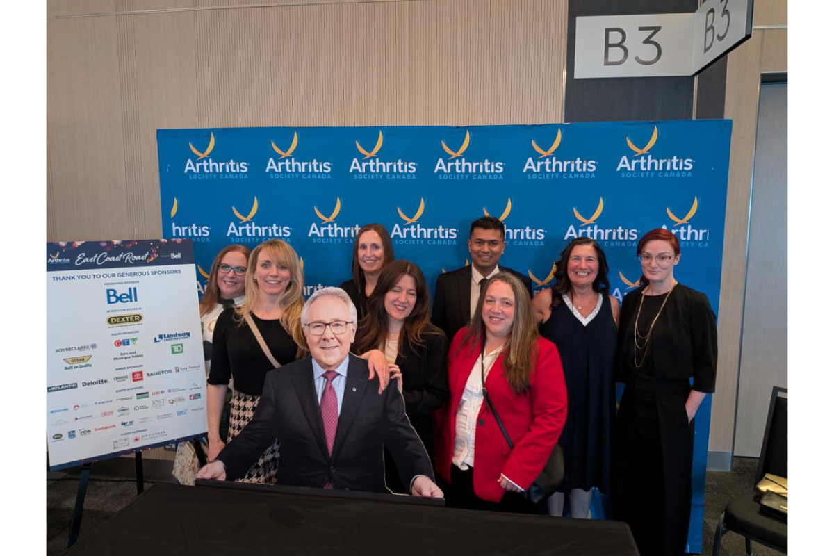 DP World's Canada employees pose at step and repeat for Arthritis Society Canada event.