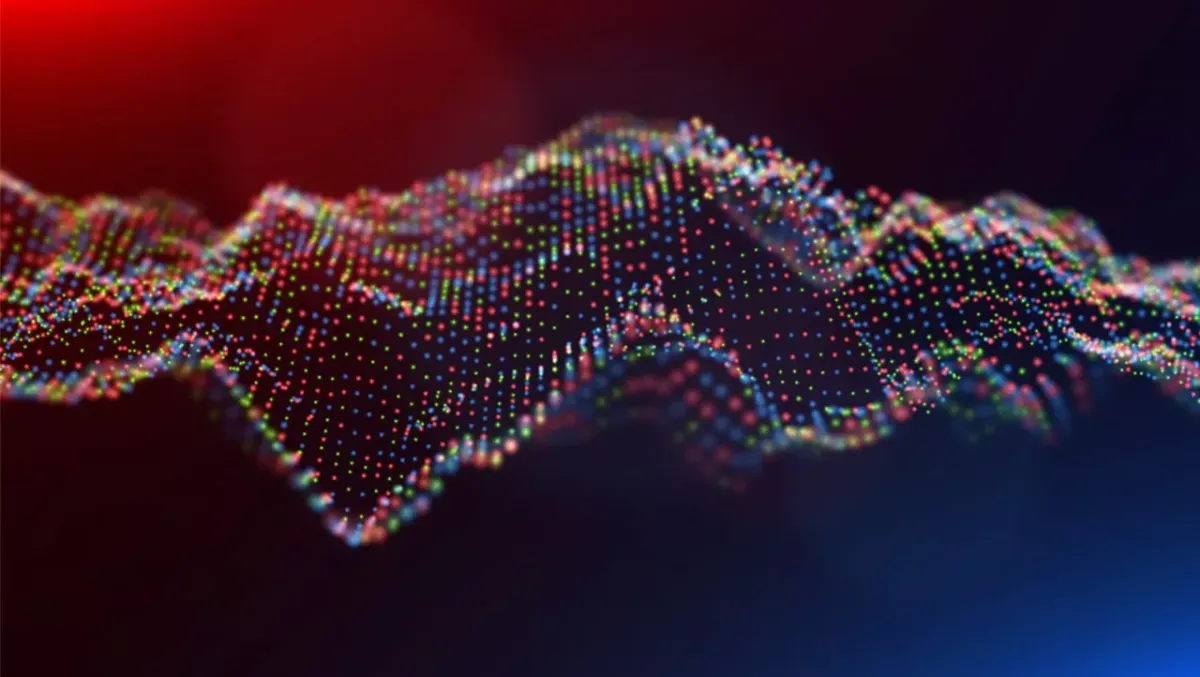 Digital rendering of waves on red, green, and blue dots.