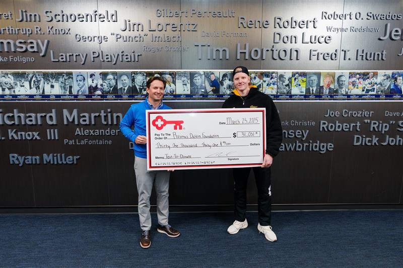 KeyBank and Rasmus Dahlin Foundation members shown with a grant check for $31,031.