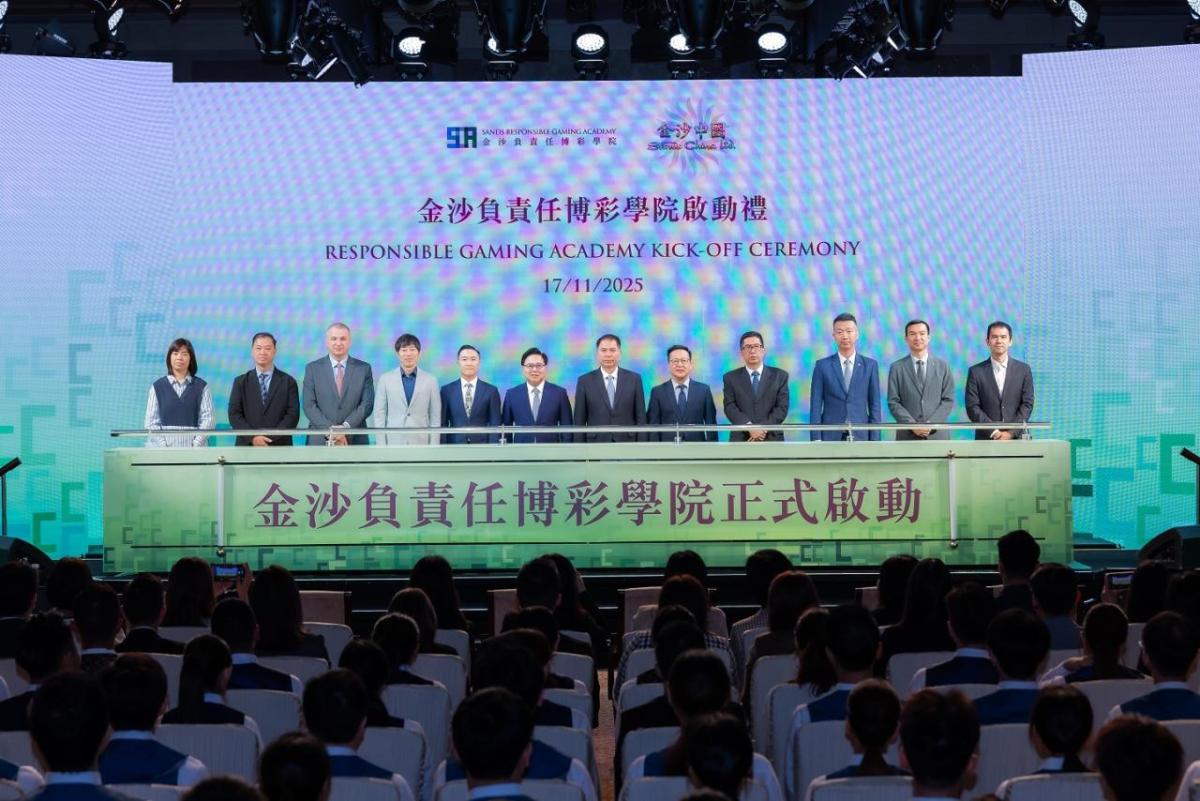 Group standing on stage under the words "Responsible Gaming Academy Kick-Off Ceremony"