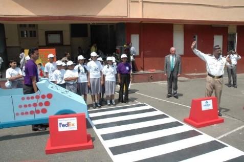 A group of people about to enter a crosswalk 