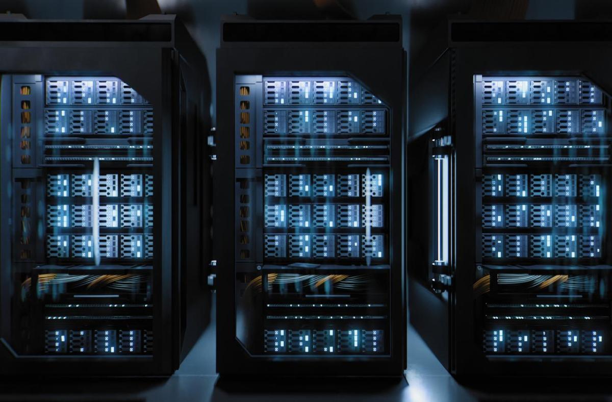 Server racks inside a modern data center, housing high-density computing equipment used for cloud computing and AI workloads.