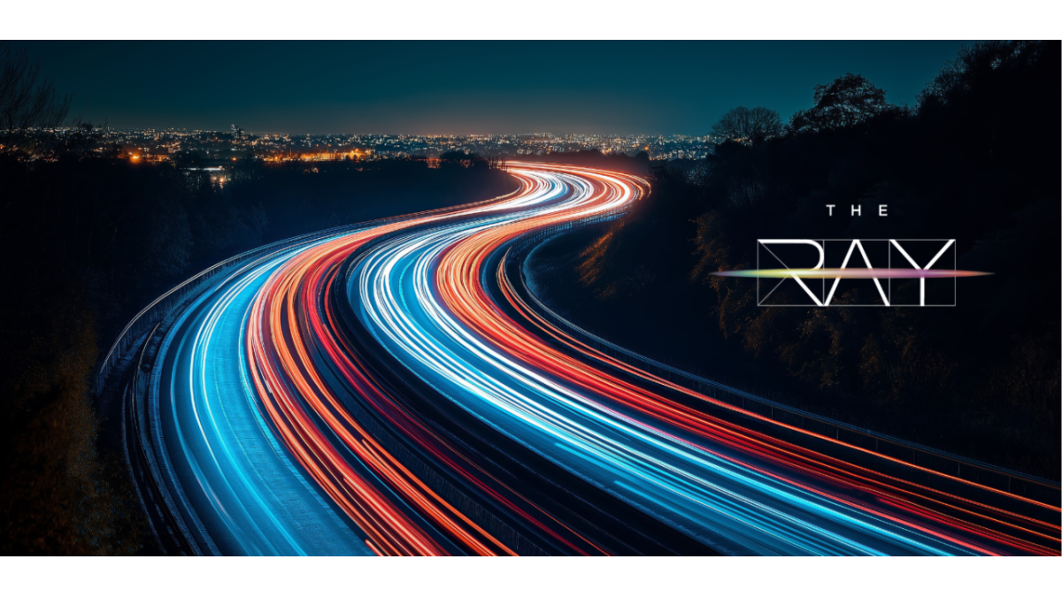 Photo of lights on highway at night with The Ray logo