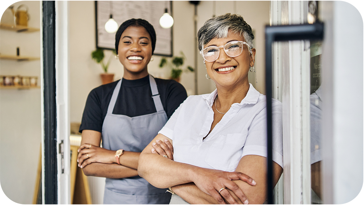 two women with arms folded 