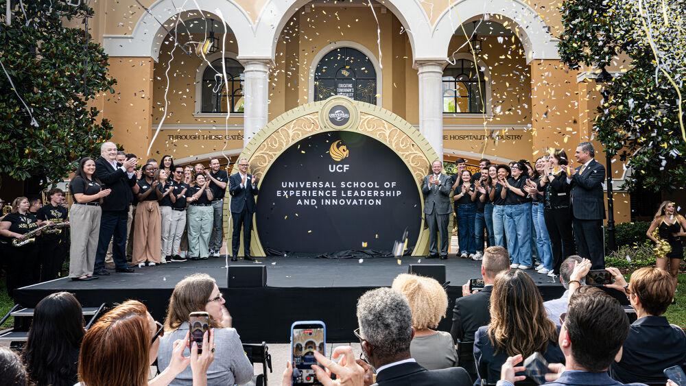 Group photo with confetti in front of Universal School of Experience Leadership and Innovation