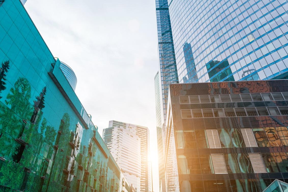 Sunlight peeking through high rise commercial buildings