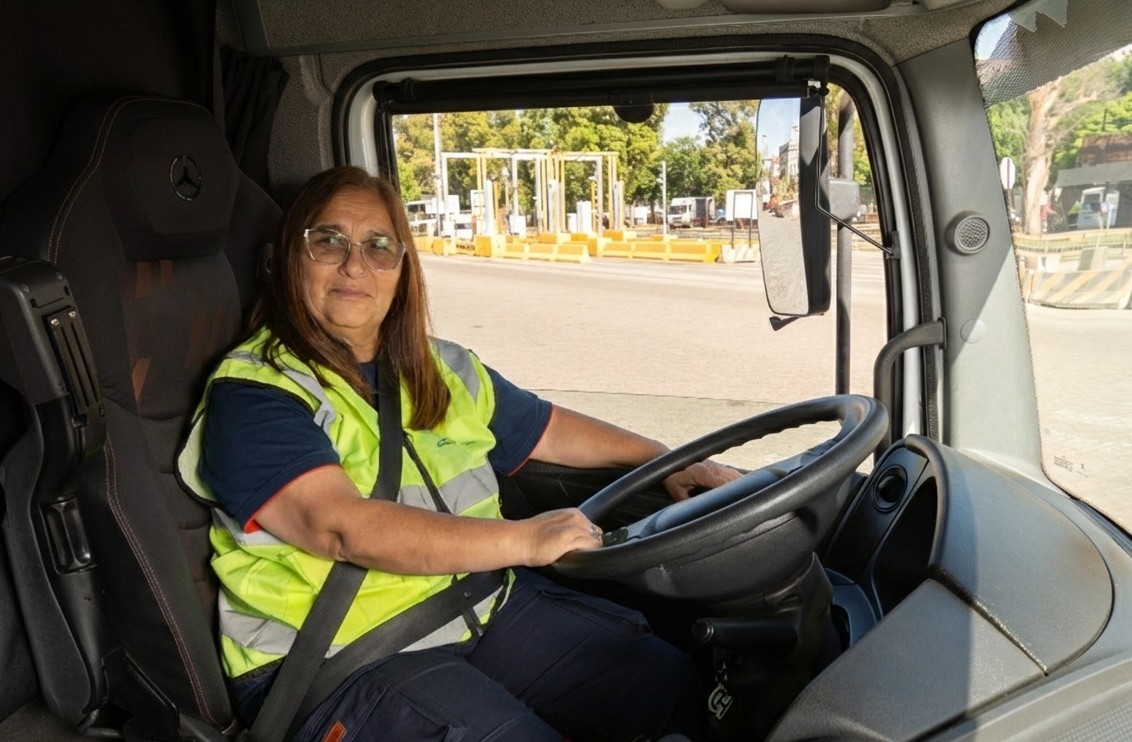 Female truck driver wearing a high-visibility vest operates a truck at DP World’s Buenos Aires terminal.