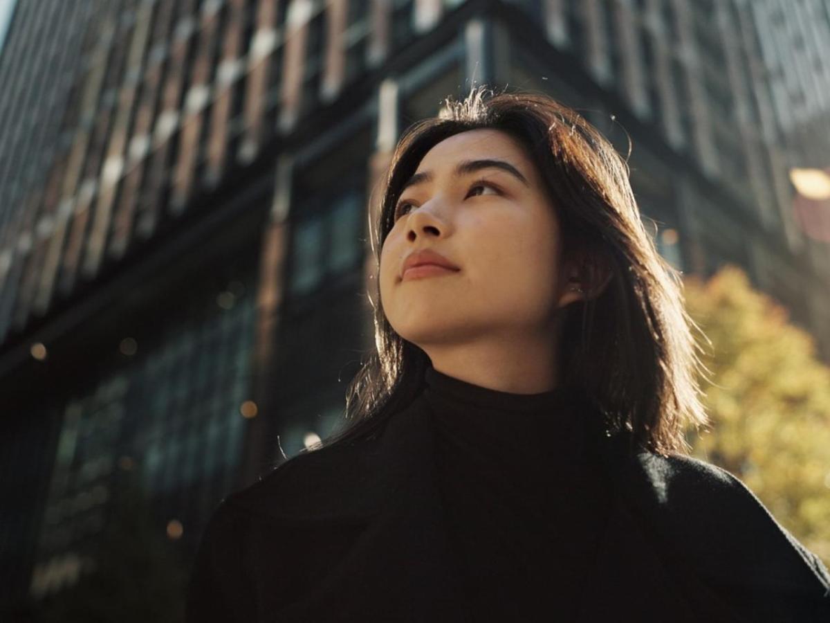 Woman standing outside in a city