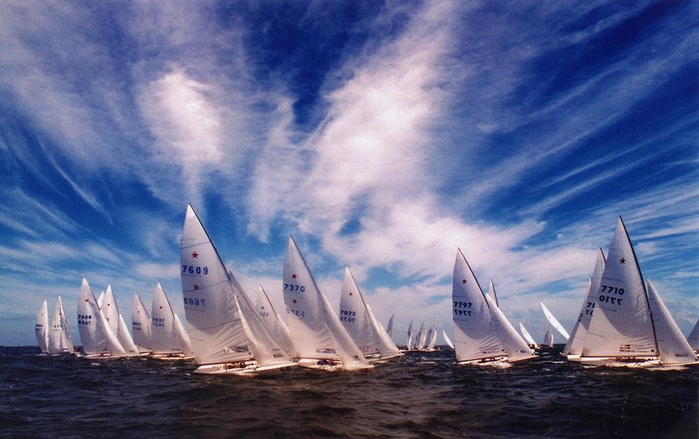 Competitors in the Star Class fleet sail across blue Biscayne Bay waters in a 1990s Bacardi Cup race.