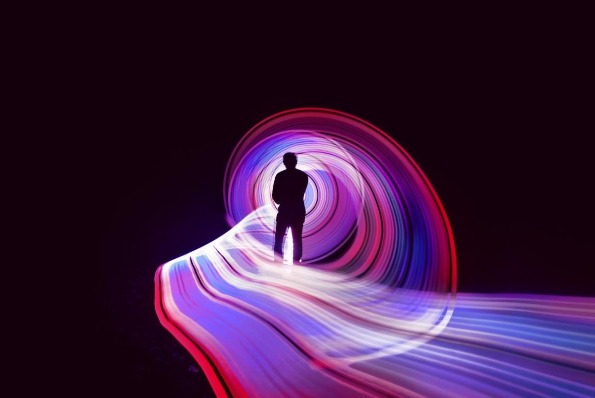 person looking at luminous light