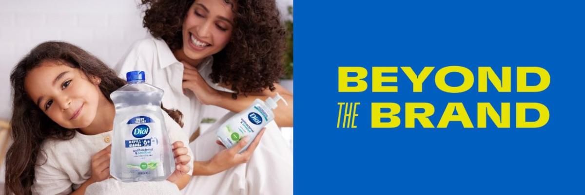 An adult and child holding Dial soap, with text "Beyond the Brand"