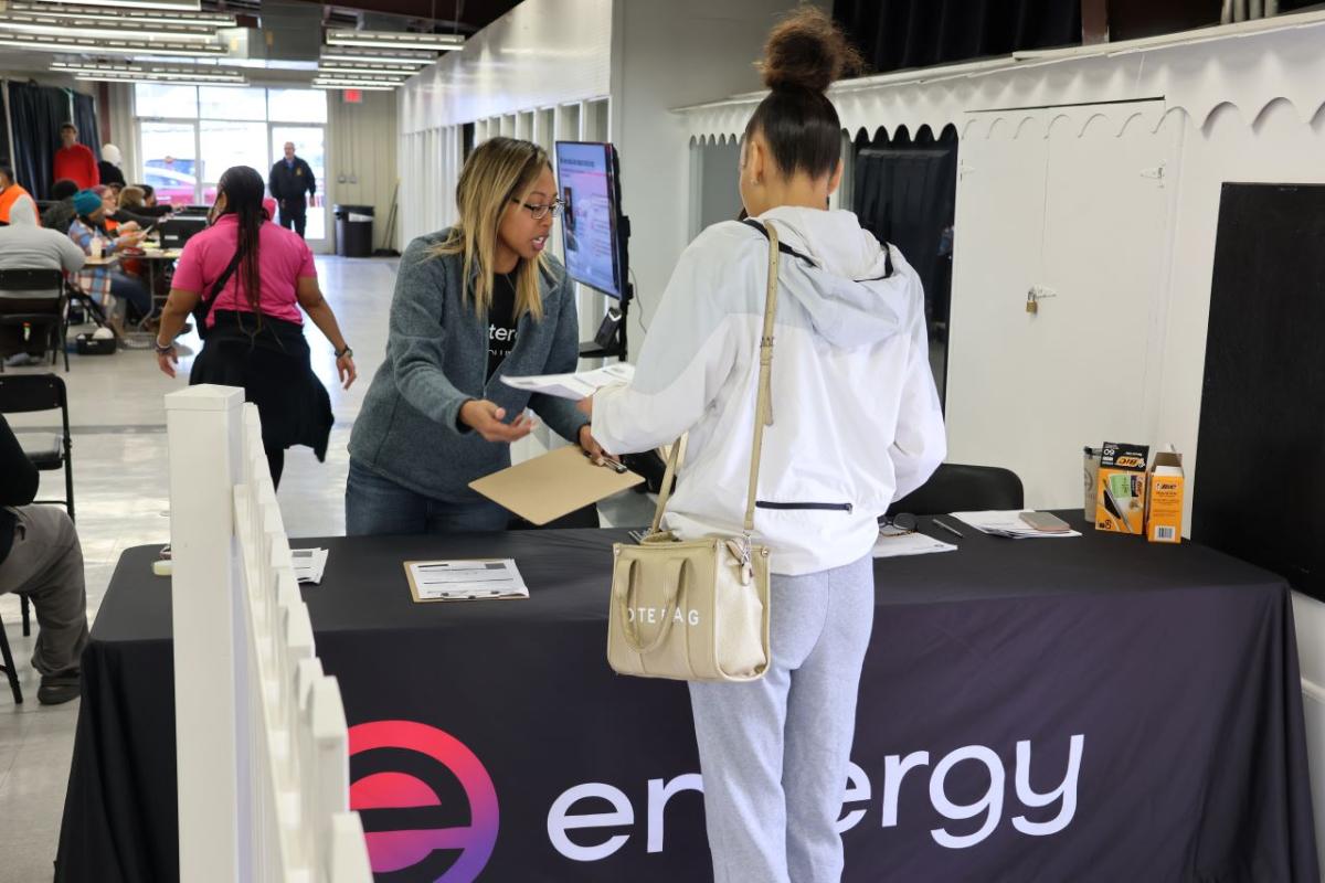 Entergy employee helping a customer at a desk