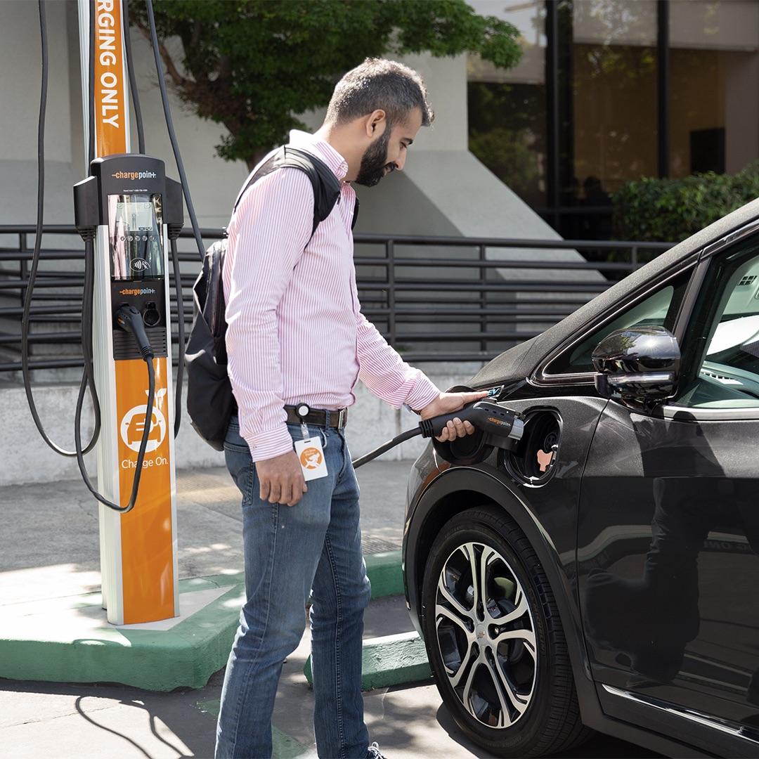 person charging a car