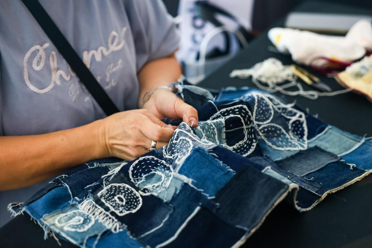 Women in blue stitching denim