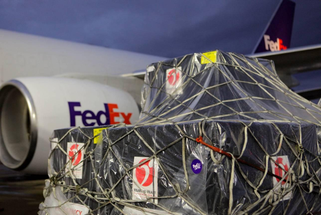 A large package outside a FedEx airplane