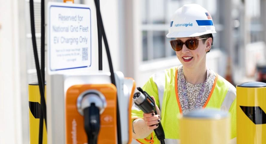 National Grid employee using an EV charger