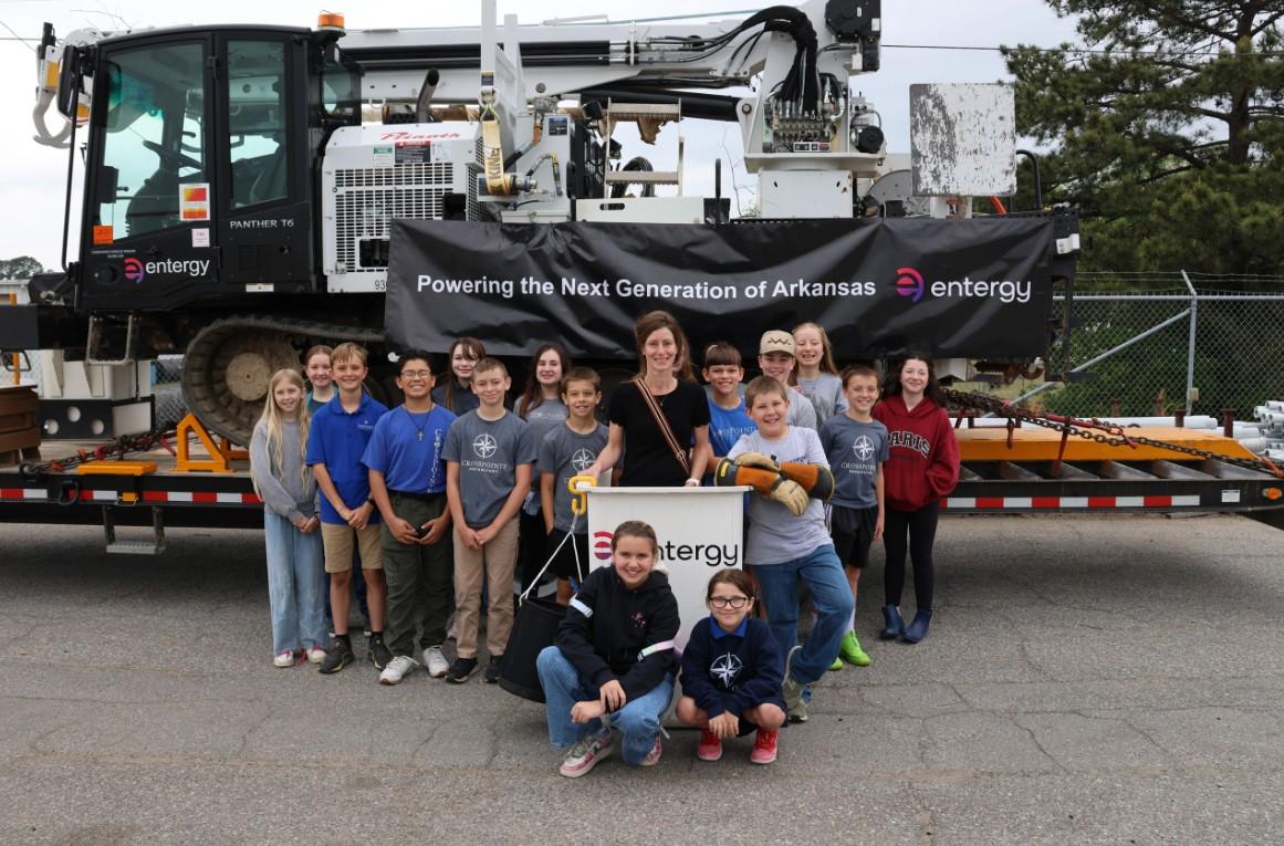 Group of students with Entergy signs