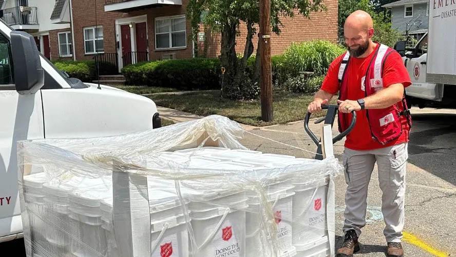 Salvation Army trucks, boxes, and volunteer