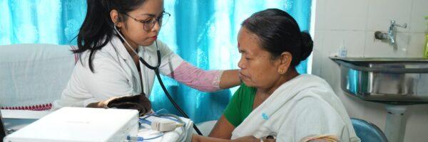 Healthcare worker attending to a patient