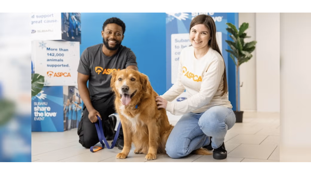 two people with a dog