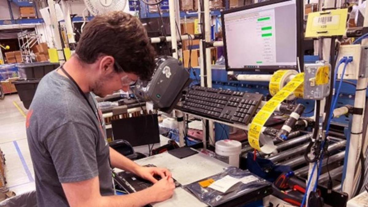 Person working on computer part