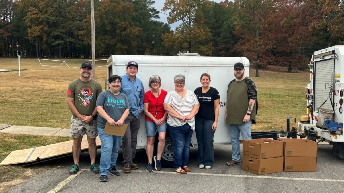 People standing together with boxes of donations