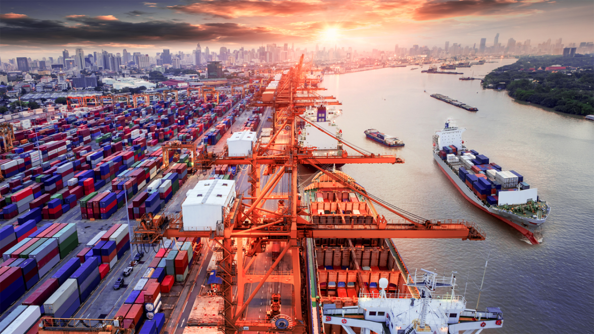 Busy port with shipping containers and vessels