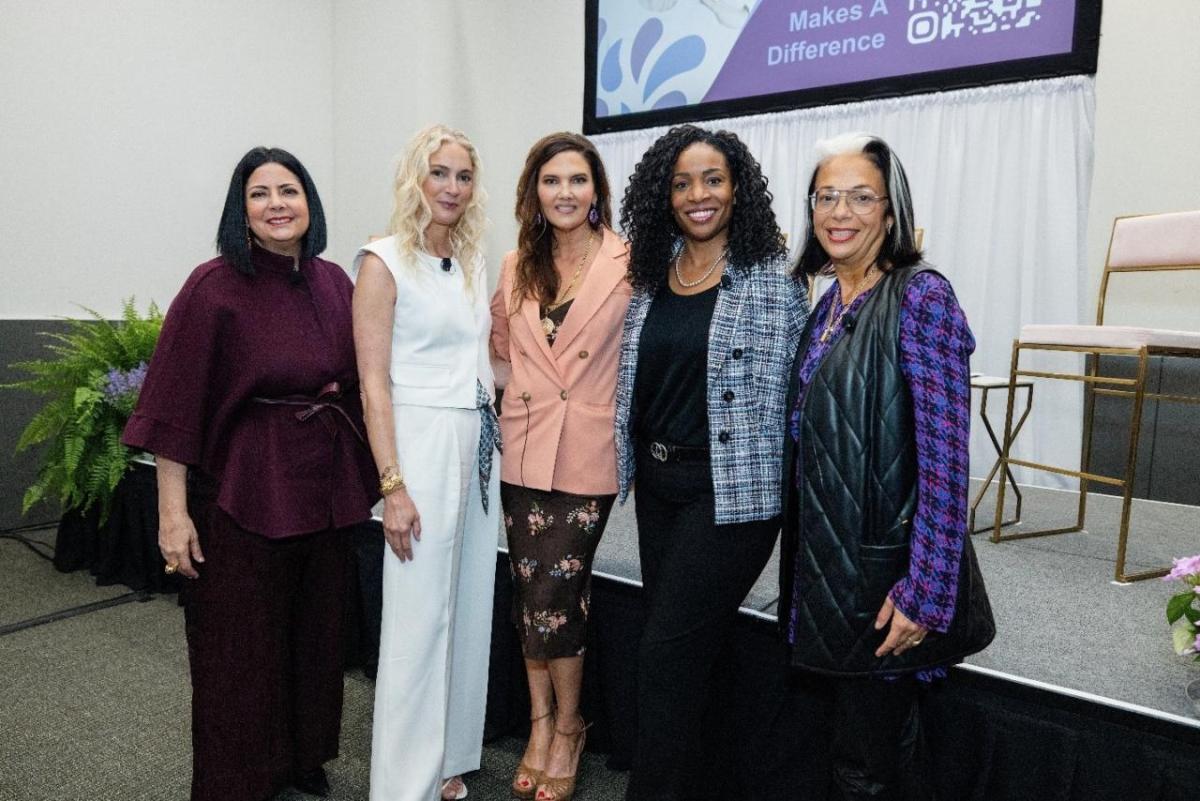 Five women standing together