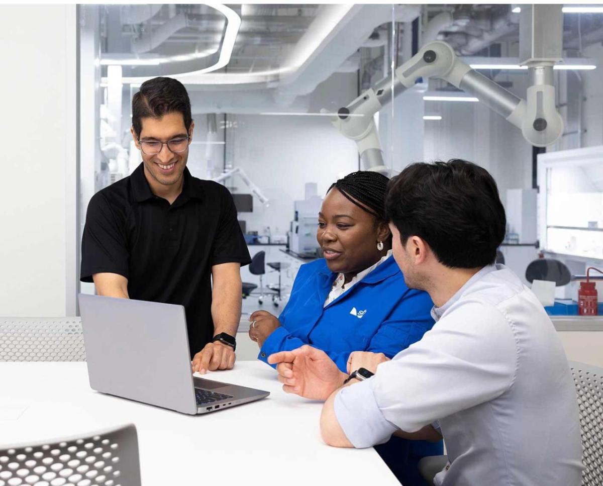 people looking at a laptop together