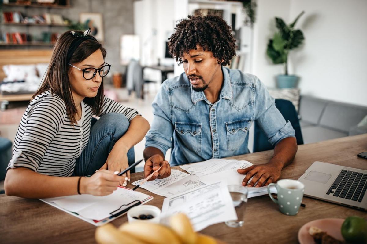 people working on bills together