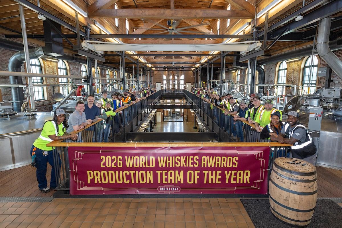 employees holding up award banner