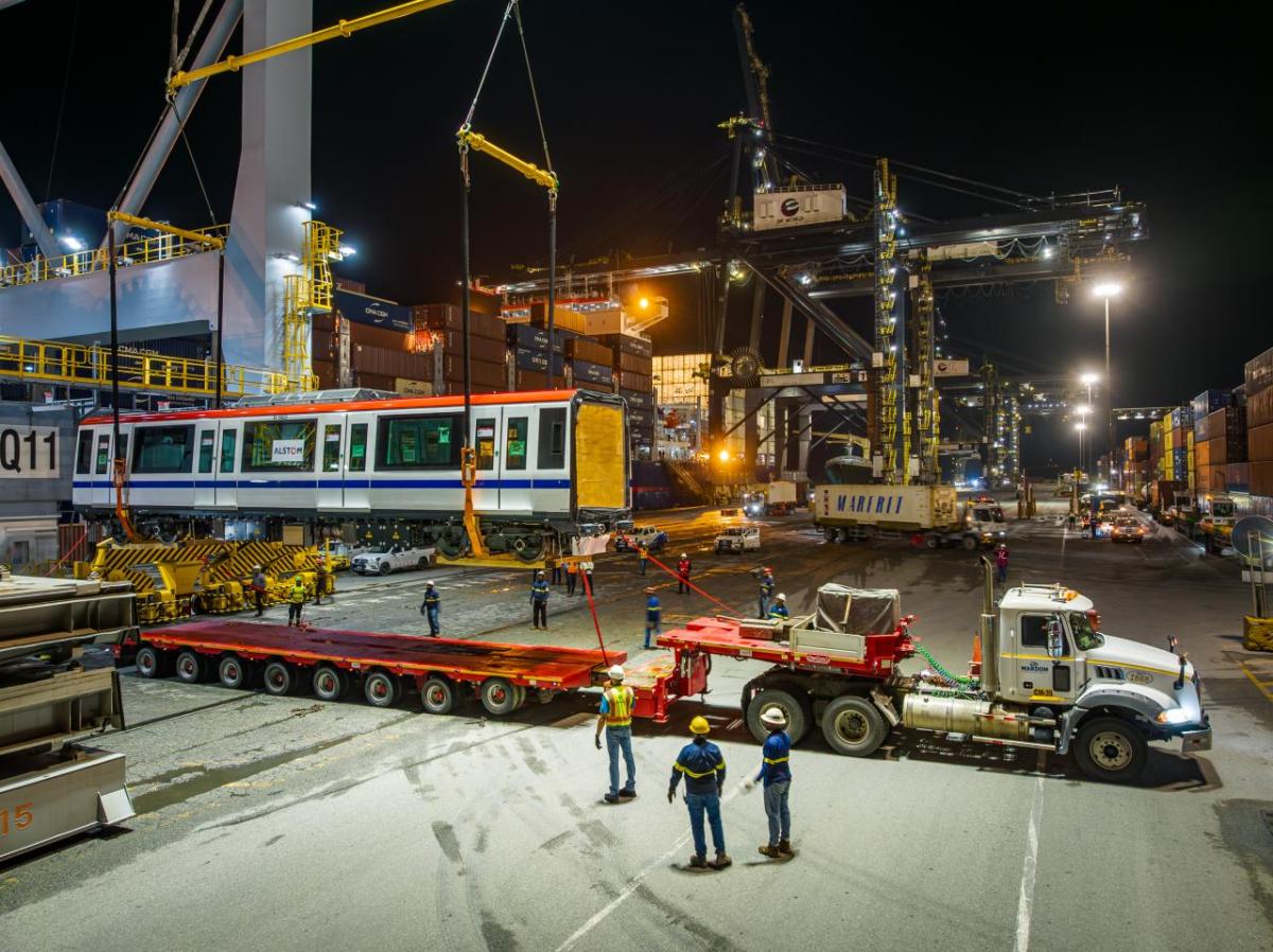 subway car getting loaded onto truck