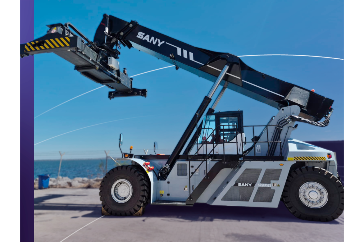 Side view of a fully electric SANY SRSC45E3 Reach Stacker at DP World’s Lirquén port terminal with ocean in background.