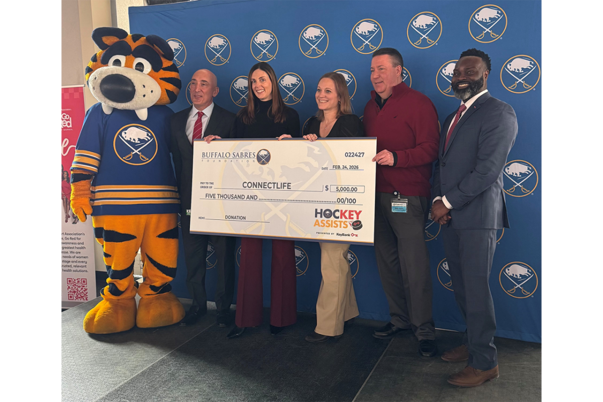 People standing with an oversized check