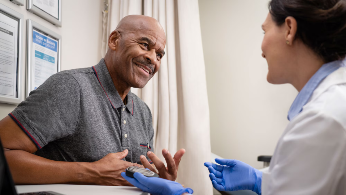 Man speaking with doctor 