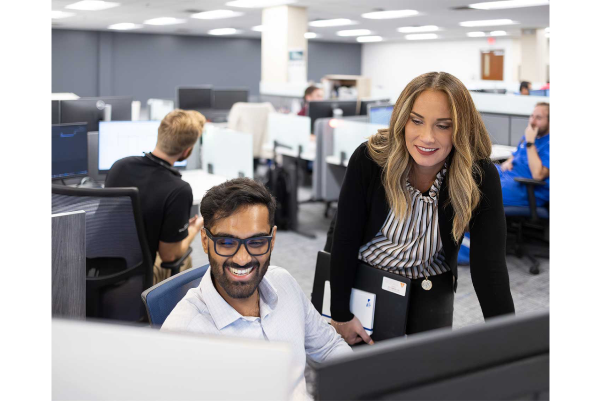 Employees working and smiling