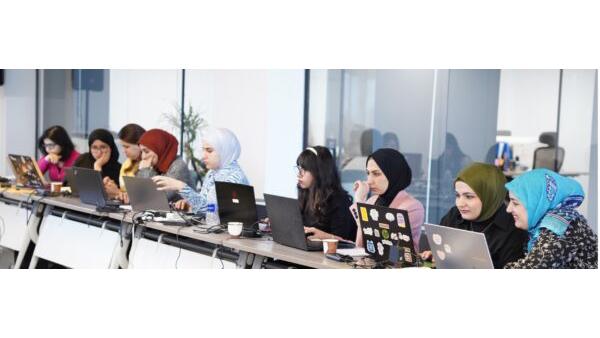 Group of young women on laptops