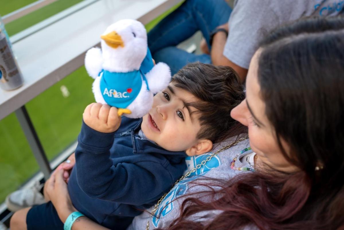 A child with an Aflac duck