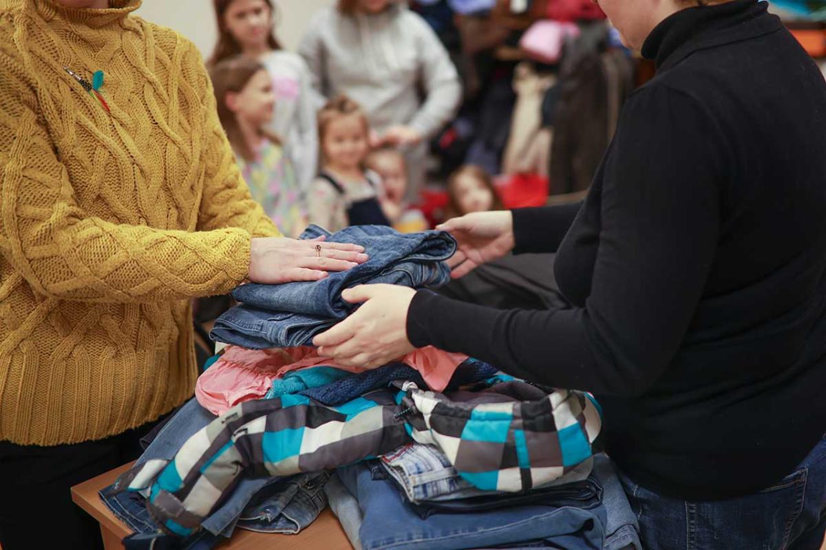 People handling clothing